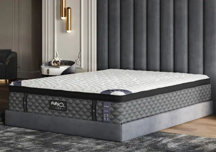 Plush and inviting Purple Hybrid Premier Mattress set in an elegant bedroom interior with luxurious gray decor and ambient lighting.