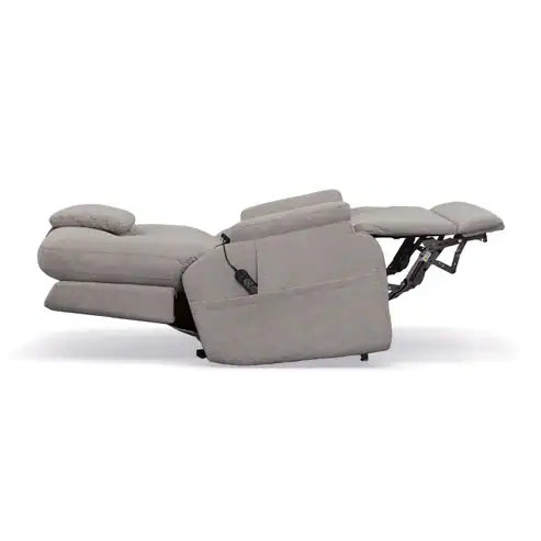 A Zecliner Model 1 Power Sleep Chair in light gray is fully extended, displaying a raised footrest and reclined backrest, with a remote control attached to the chair’s side.