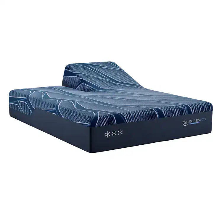The Serta iSeries NXG 3500 Hybrid — Medium mattress in blue, featuring a geometric pattern and snowflake symbols, is displayed on an adjustable bed base with the head section elevated.