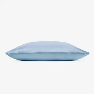 A light blue Hyper Silk Performance Pillowcase rests flat on a white background, highlighting its smooth and shiny satin texture.