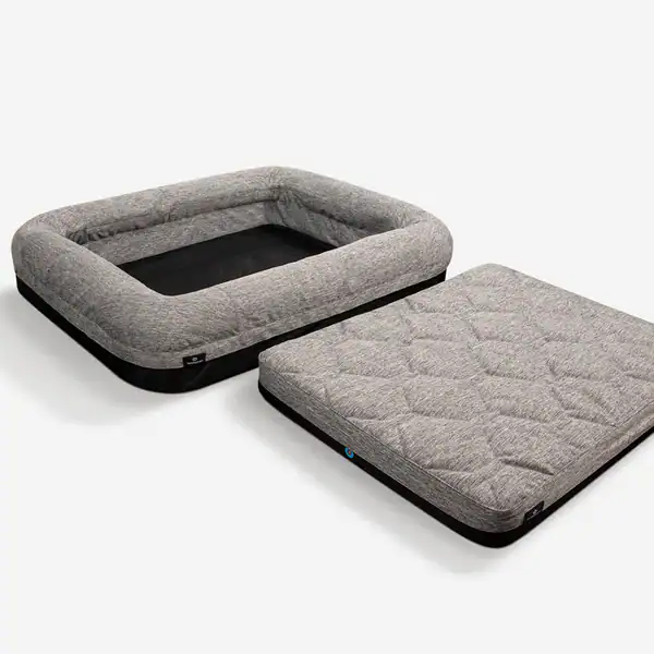 The rectangular gray Performance Dog Bed, featuring raised sides and a matching removable cushion made of soft fabric, is displayed on a white background.