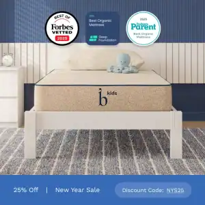 A modern bedroom centers a Birch Kids Natural Mattress with beige cover, blue trim, and plush blue octopus. Displayed: Forbes Vetted 2025, Sleep Foundation, and Parents 2025 badges. 25% off New Year Sale—Code: NYS25.